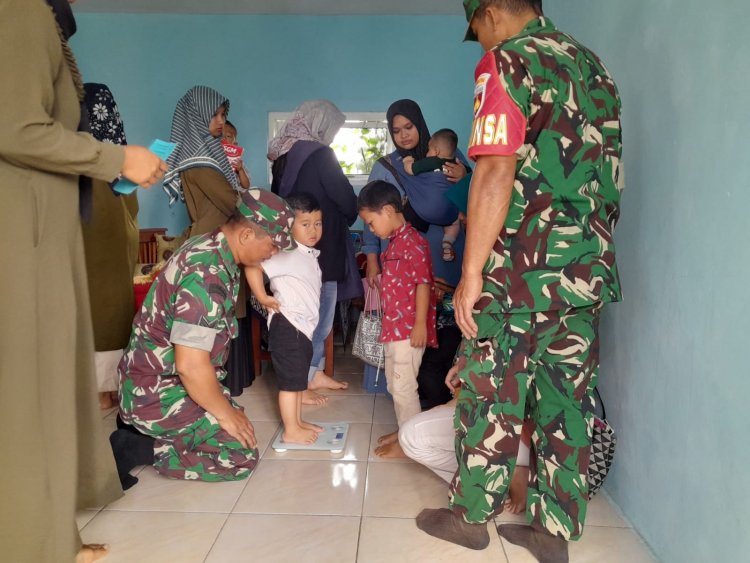 Wujudkan Balita Sehat,Babinsa Bersama Bidan Desa Melaksanakan Kegiatan Posyandu Balita